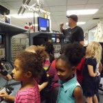Students at the hands on display shuttle consoles