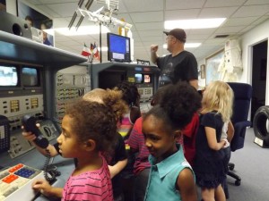 Students at the hands on display shuttle consoles