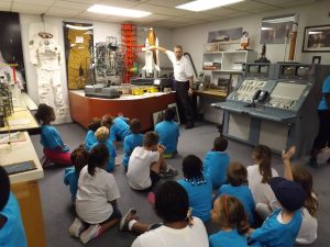Docent Bruce Jacobs teaching kids in American Space Museum Space Shuttle Gallery